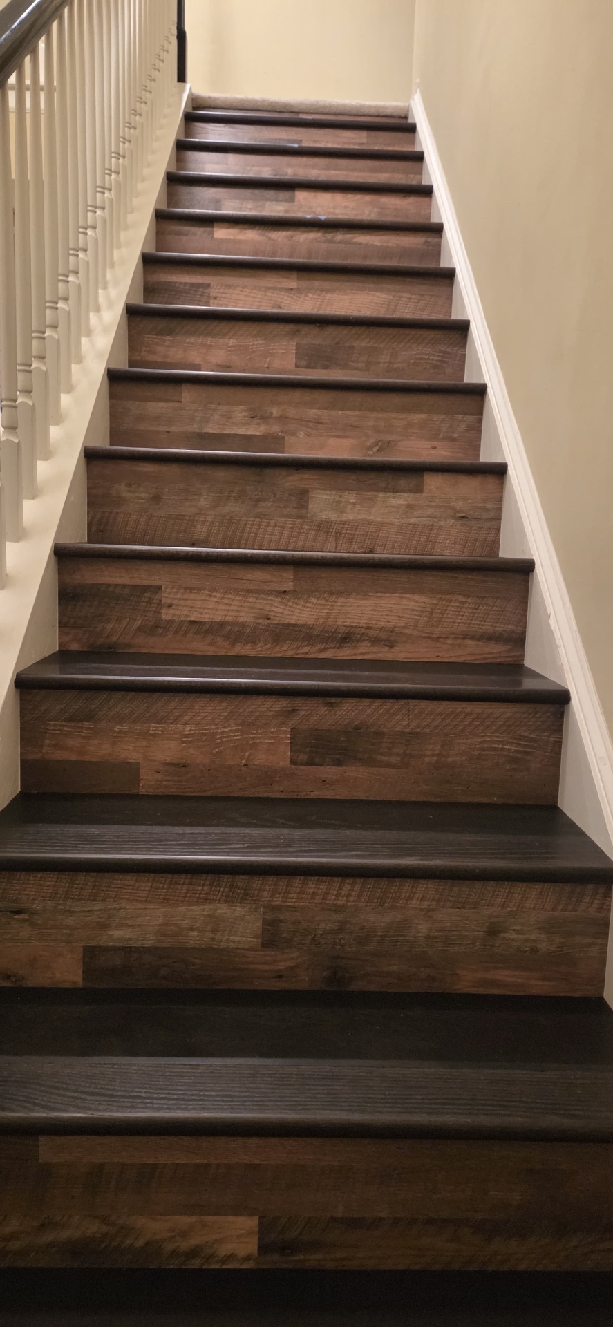 Rustic oak stair risers with dark stained treads